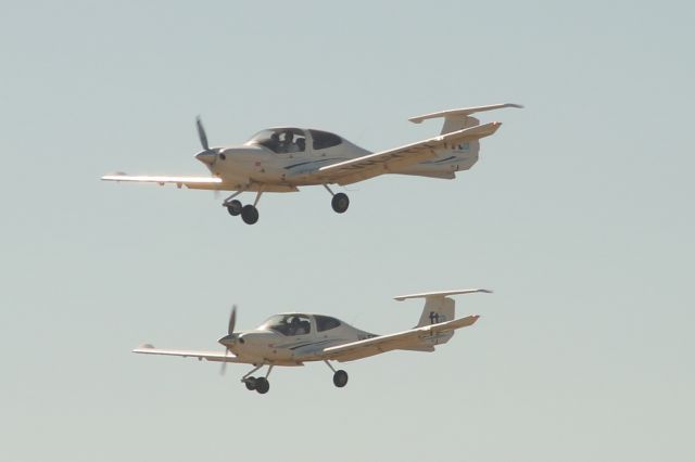 Diamond Star (VH-YTV) - Two Flight training Adelaide Diamond DA40's doing a formation onto runway 23.