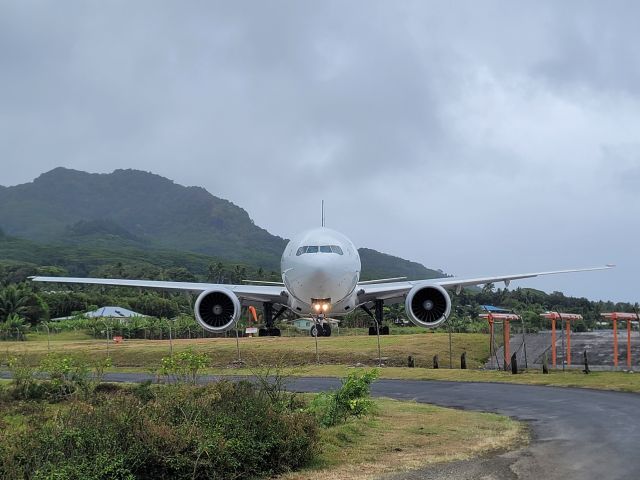 BOEING 777-300 (ZK-OKN) - ANZ 945 creeps down the runway at Rarotonga International Airport in preparation for an unusual east to west departure.