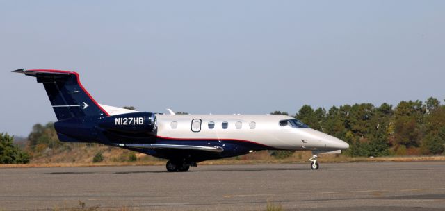 Embraer Phenom 300 (N127HB) - Taxiing for departure is this 2012 Embraer Phenom 300 in the Autumn of 2022.