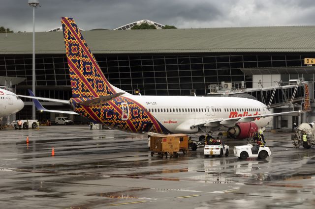 Boeing 737-800 (9M-LCF) - Gorgeous vivid colors after the afternoon rain in Kuala Lumpur. One of 14 Boeing 737-800s (9M-LCF) in Malindo's fleet is seen parked at the gate at KLIA1. Photograph: 2nd January, 2020. (See http://www.planexplorer.net/Xploregallery/displayimage.php?pid=1644 )