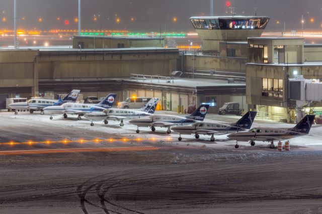 — — - Holiday spirit in the tower, snow day for Cape Air on the ramp. First snow of the season in Boston.