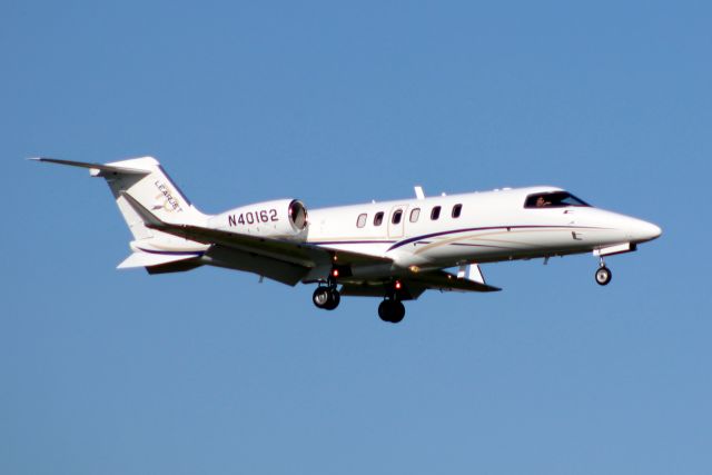 Learjet 45 (N40162) - On final approach for rwy 07 on 22-Oct-14 after a local flight.