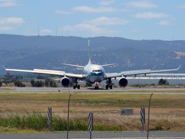 Airbus A330-300 (B-HLQ) - Turning from runway 23 on to taxi-way, after arrival from Hong Kong. Wednesday 4th January 2012.