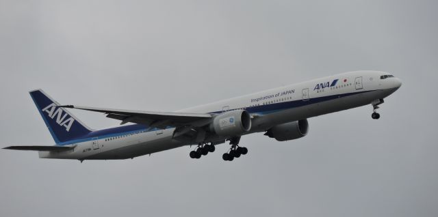 BOEING 777-300ER (JA779A) - Approaching runway in May of 2017. Livery has Olympics and GE on engines.