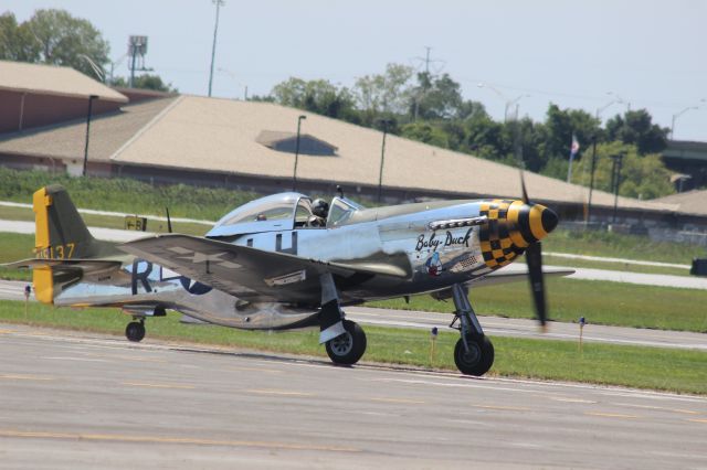 NL251PW — - "Baby Duck" getting ready to taxi by the crowds in the parking lot at Gary Regional Airport.