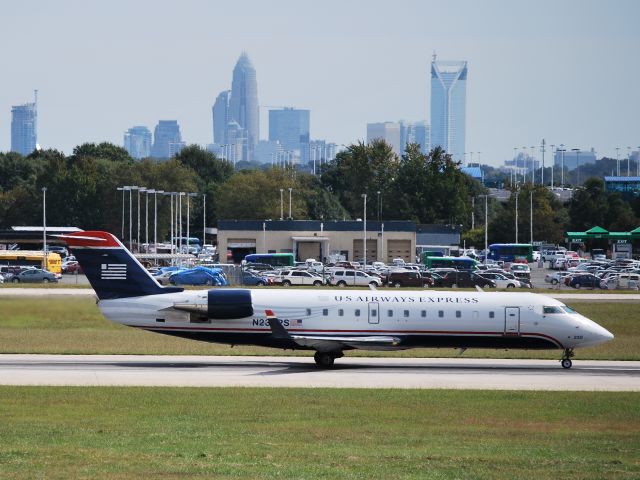 Canadair Regional Jet CRJ-200 (N230PS) - Rolling down runway 18C - 10/4/09