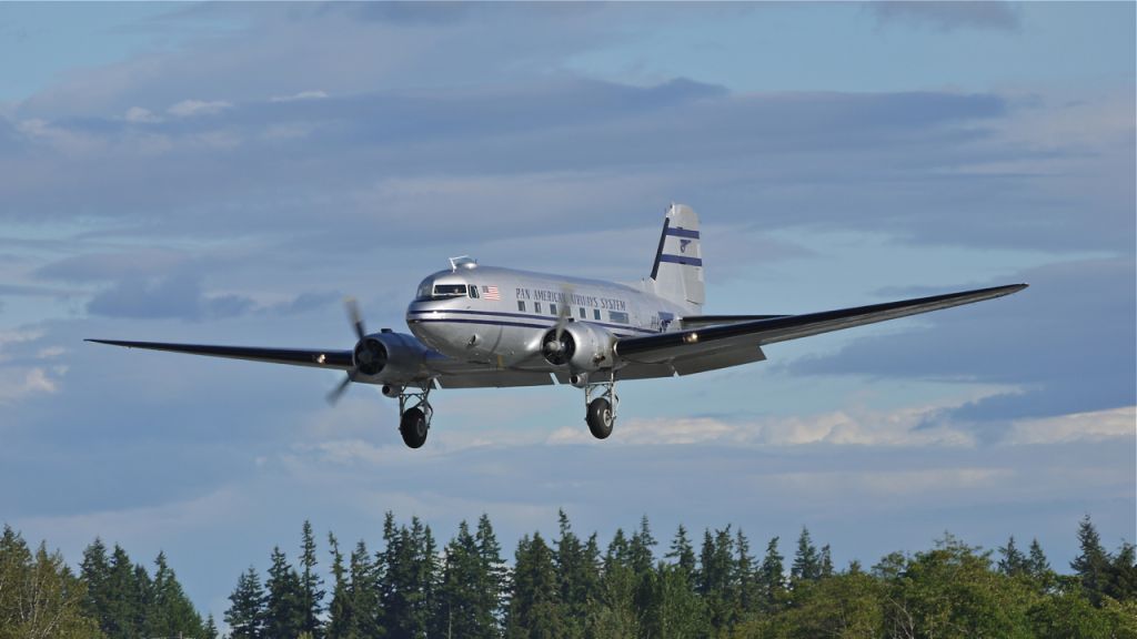 Douglas DC-3 (N877MG) - Historic Flight Foundations Douglas DC-3 on final to runway 34L on 6/12/13. (Ser#4193).