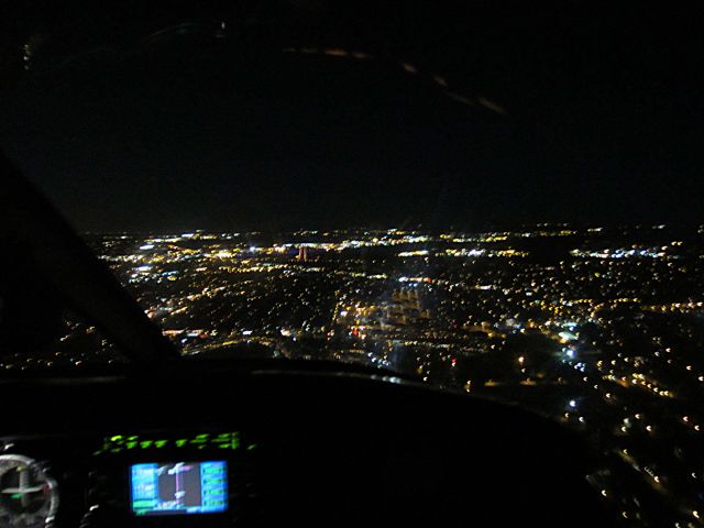 Piper Cherokee (N80FG) - Night GPS approach,, I like the visual of the runway lined up with the GPS.. sorry my Right Seat took a blurry shot but she does love to fly with me ::)))