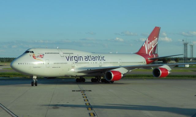 Boeing 747-200 (G-VROS) - "English Rose" pulling into the gate at Orlando (MCO). She took me and only 54 fellow passenger back to London Gatwick...very light load, felt like I had the whole plane to myself (October 2011)