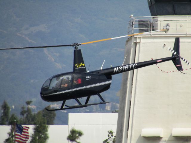 Robinson R-44 (N316TC) - Lifting off from Brackett Field