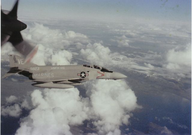 McDonnell Douglas F-4 Phantom 2 (EFY5823) - "Escort" Fixed Wing Marines Fighter Attack Squadron VMFA-115 Silver Eagles 1980 pictured from the flight deck VP-23 Seahawks P-3C Orion. VMFA-115 was deployed on the USS Forrestall CVA-59 with CVW-17 in the North Atlantic when assigned to this mission