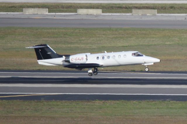 Learjet 35 (C-GAJS) - CGAJS arrives on Runway 19L at Tampa International Airport