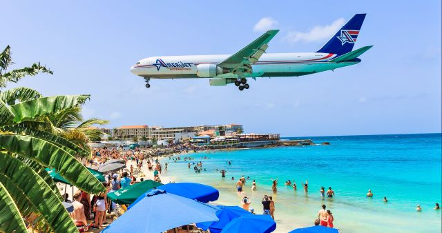 BOEING 767-300 (N396CM) - That moment every one stops what they are doing and stare at the passing metal bird. Amerijet Boeing 767 N396CM over maho beach. 23/07/2019