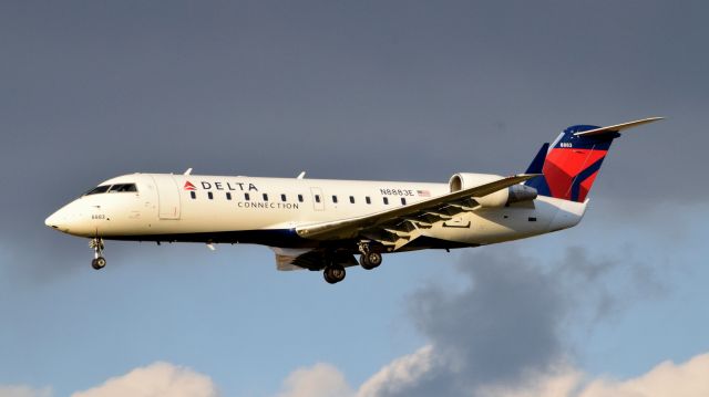 Canadair Regional Jet CRJ-200 (N8883E) - A Delta Connection CRJ-200 landing at Philadelphia International Airport on December 10th, 2016.