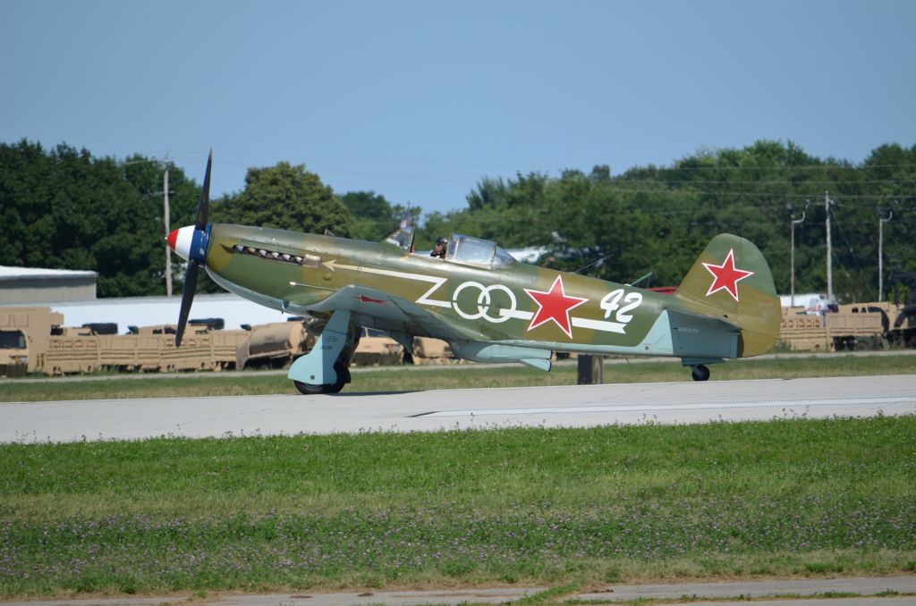 YAKOVLEV Yak-9 (NX1157H) - EAA 2011 YAK-9, (a beautiful and underrated aircraft) taxiing back to warbirds area.