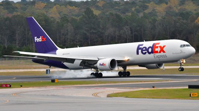 BOEING 767-300 — - FedEx Express Boeing 767-300 (N140FE) arrives KRDU Rwy 23L on 10/26/2019 at 5:58 pm.