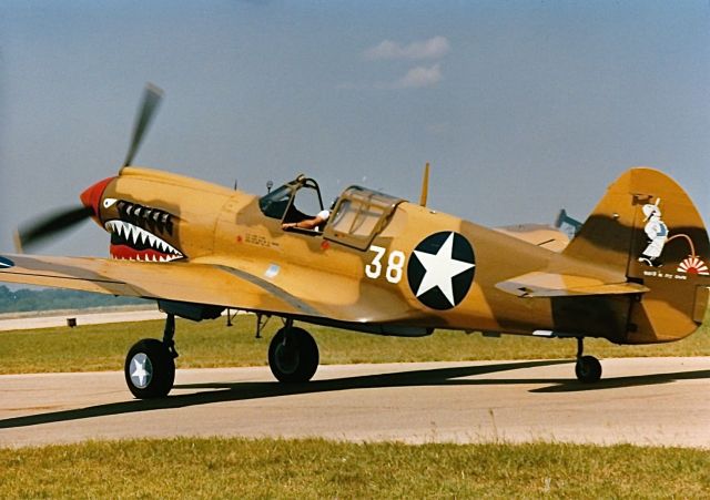 CURTISS Warhawk — - P-40 in Flying Tigers marking at a CAF Air Show