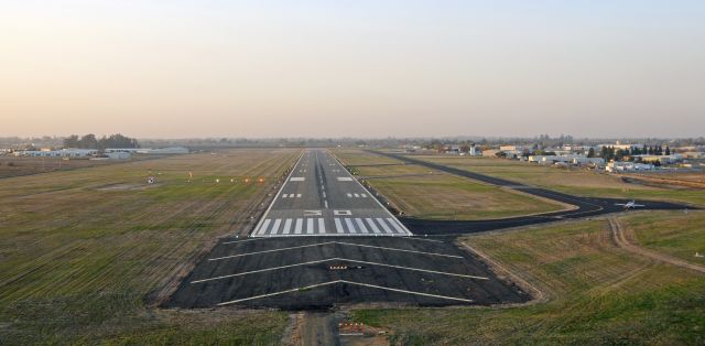 — — - On short final, runway three-zero, Merced Regional Airport (KMCE)
