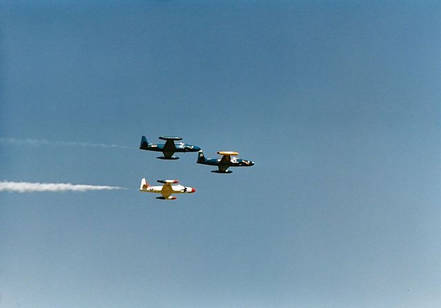 Lockheed T-33 Shooting Star — - Flight of 3 private owned T-33s doing a fly by at the EAA Fly In in a arrow head formation