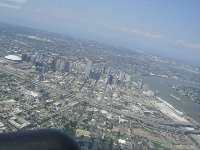 Beechcraft Bonanza (36) (N136JL) - Circling from the northwest to land 36R at KNEW