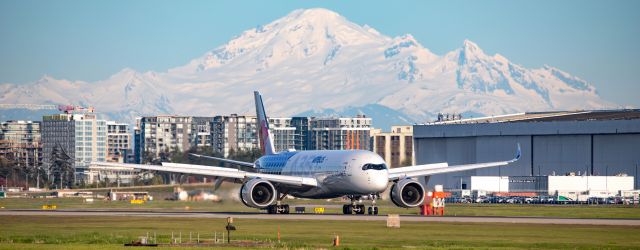 Airbus A350-900 (B-18918) - China Airlines Airbus A350 carbon fibre livery arrival at YVR from TPE. Since some people complained about the construction cranes on a previous photo, I removed 2 of them on this one. I'm not a Photoshop pro. Maybe you can tell, or not ;)