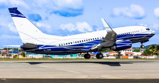 Boeing 737-700 (P4-NGK) - P4-NGK departing St Maarten and playing catch up with his baby sister!! 05/01/2019