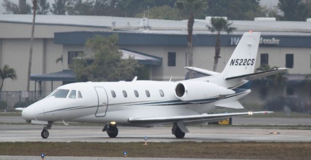 Cessna Citation Excel/XLS (N522CS) - Taxing on a rainy day on 02/11/2011