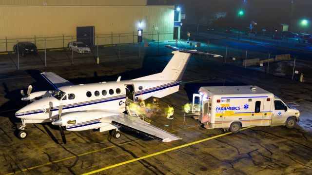 Beechcraft Super King Air 200 (BXH757) - Foggy Night. C-GXHR is off loading a patient from a medevac