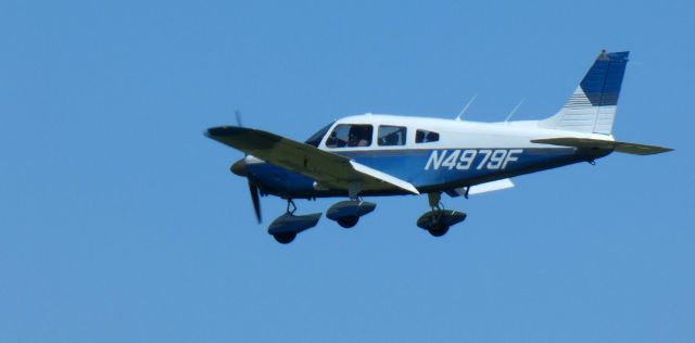 Piper Cherokee (N4979F) - About to touch down is this 1976 Piper PA-28-181 Archer II in the Summer of 2024.