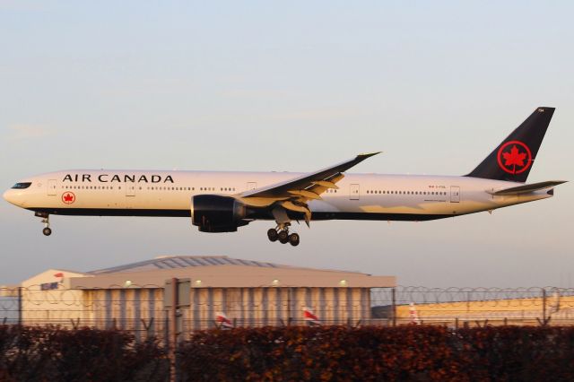 BOEING 777-300ER (C-FIUL) - An Air Canada B777-300ER on final approach into LHR, landing on runway 27L.br /br /Location: Great South West Road.br /Date: 20.12.22 (dd/mm/yy).