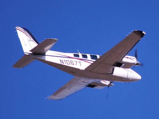 Beechcraft Baron (58) (N1067T) - Departing from runway 02 at Concord Regional Airport - 2/23/09