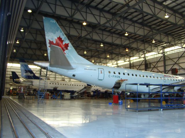 Embraer ERJ-190 (C-FHON) - Embraer 170 Air Canada getting work done next to Jet Blue Embraer 190 in Nashville at Embraer.