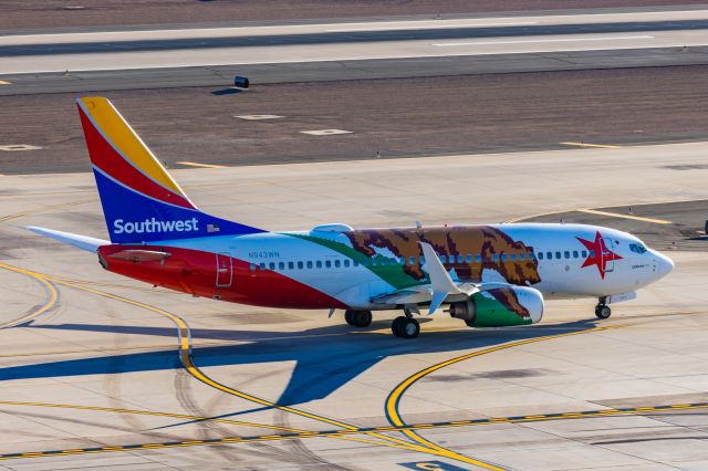 Boeing 737-700 (N943WN) - A Southwest Airlines 737-700 in California One special livery taxiing at PHX on 2/12/23 during the Super Bowl rush. Taken with a Canon R7 and Canon EF 100-400 II L lens.