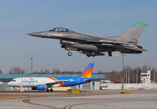 Lockheed F-16 Fighting Falcon (90-0702) - One of the stingers, an F-16 Fighting Falcon of the 180th Fighter Wing, 112th Fighter Squadron, passing an Allegiant A320, N259NV while departing RWY 25 last March (2022).