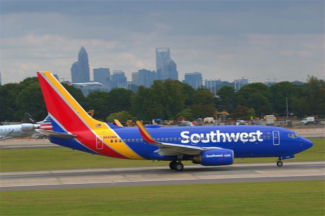 Boeing 737-700 (N449WN) - 449WN taking off using Rwy 18C with the City of Charlotte in the background