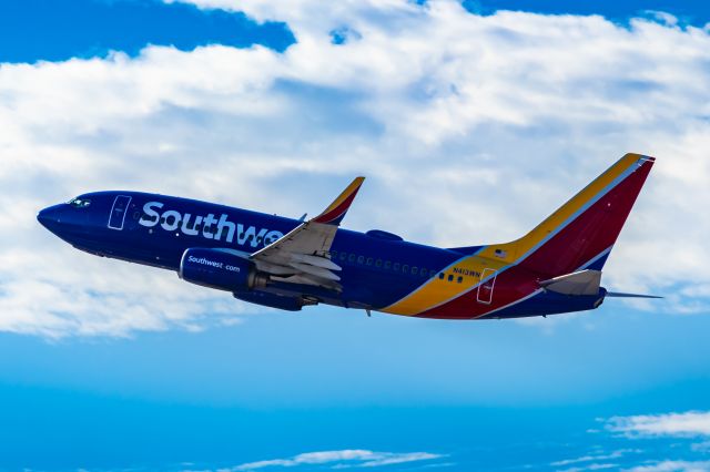 Boeing 737-700 (N413WN) - Southwest Airlines 737-700 taking off from PHX on 10/22/22. Taken with a Canon 850D and Tamron 70-200 G2 lens.