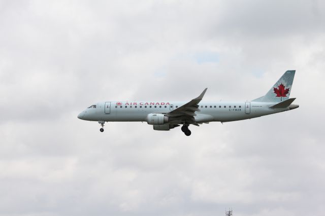 Embraer ERJ-190 (C-FMZR) - Taken by my brother Gord at YYC at the end of runway