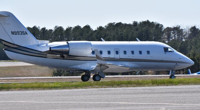 Canadair Challenger (N993SA) - A Challenger Cl600 out of Cheyenne, Wyoming picks up speed down the runway at Wall, NJ (KBLM) on a windy, spring afternoon.