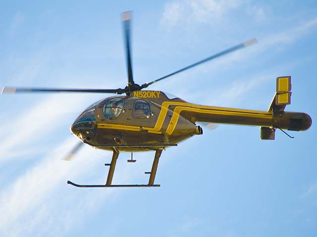 N520KY — - I captured this MD 500N hovering near the UAB Medical Center, Birmingham, Ala. what they were doing is a mystery. They seemed to be inspecting several commercial property pieces. (An f-Stop 5.6 Photo)