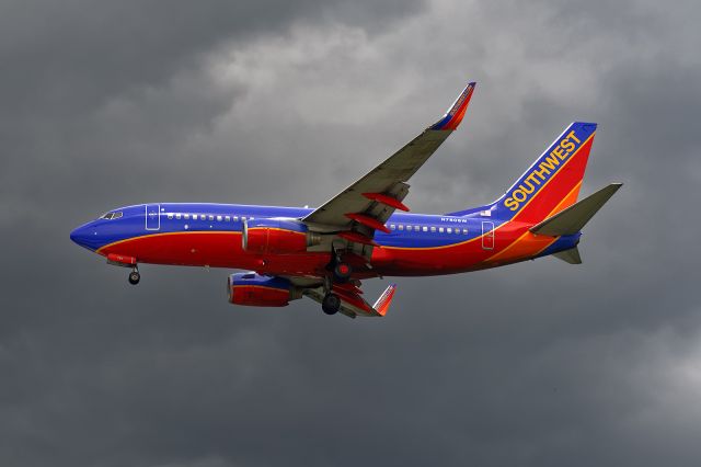 Boeing 737-700 (N780SW) - Short final to 1L 7/3/2015 with a large thunderstorm East and very close to the field.