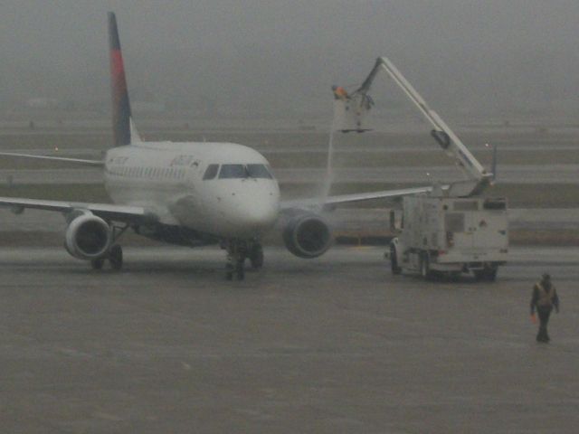 N751CZ — - Delta 5811 receiving some deicing before leaving.