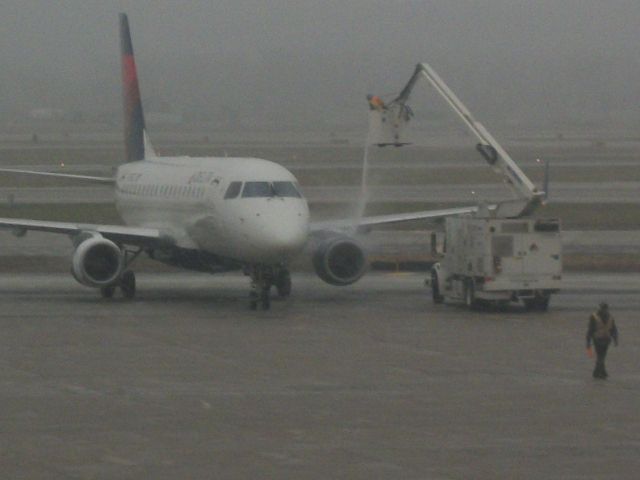 N751CZ — - Delta 5811 receiving some deicing before leaving.