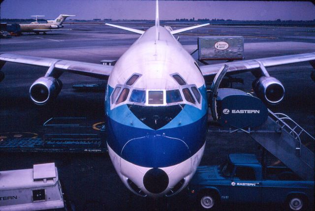 Beechcraft 35 Bonanza (N275B) - Eastern Airlines Dc 8-61 is in the boarding process. 