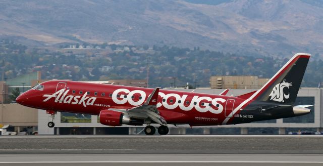 EMBRAER 175 (long wing) (N661QX) - Horizon's special Washington State University "Cougars" collegiate livery (N661QX) has the mains down and rolling on 17R as it lands at RNO to complete the front half of a KSEA-KRNO-KSEA round trip run.