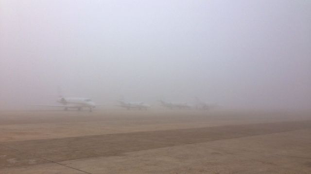 Cessna Citation Sovereign — - Row of Citations in the fog
