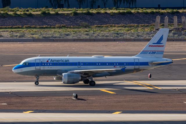 Airbus A319 (N744P) - An American Airlines A319 in Piedmont retro livery taxiing at PHX on 2/13/23, the busiest day in PHX history, during the Super Bowl rush. Taken with a Canon R7 and Canon EF 100-400 II L lens.