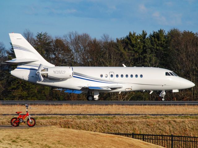 Dassault Falcon 20 (N36EP) - A Falcon 2000 landing at GMU on a 70 degree February evening.  The plane is what the bike wants to be when it grows up!  2/9/21.