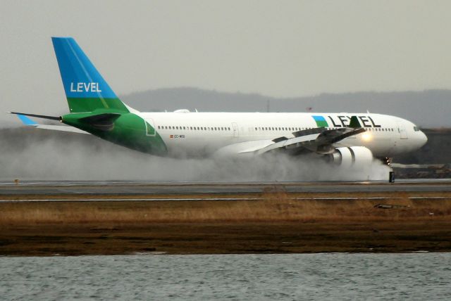 Airbus A330-200 (EC-MOU) - IBE 2625 from Barcelona touching down on a rain soaked 27