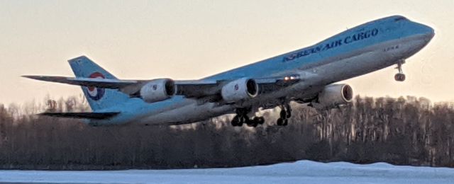 BOEING 747-8 (HL7629) - East side of N-S runway, takeoff at sunset