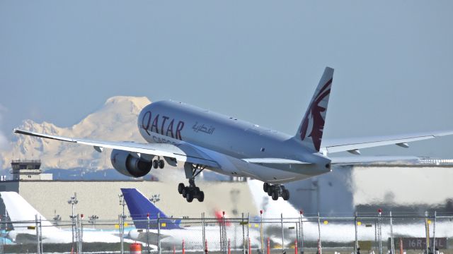 Boeing 777-200 (A7-BFD) - BOE114 (LN:1004) climbs off runway 34L to begin its maiden flight on 3/23/12. A snow covered Mt Baker is in the background on this sunny Spring day in the Northwest.